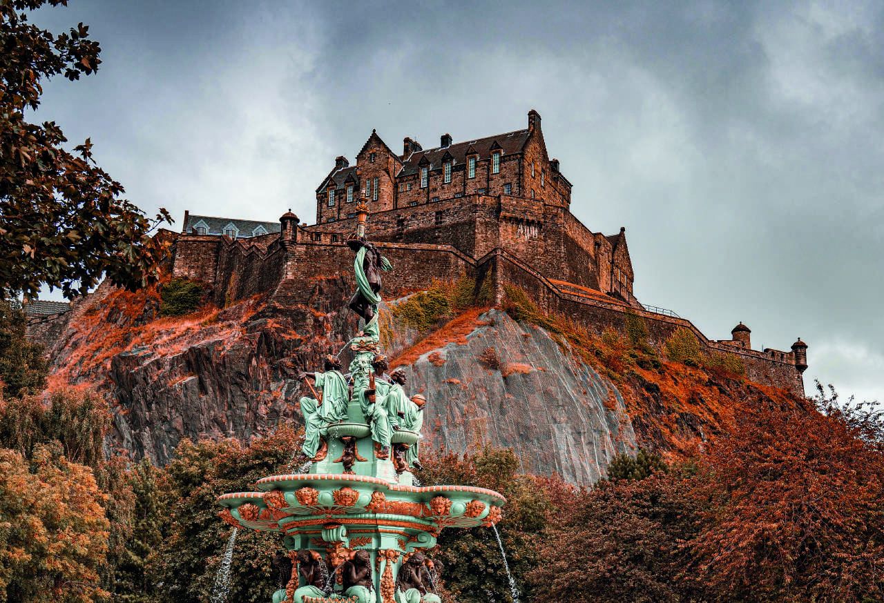 Edinburgh Castle on its crag above Princes Street Gardens, the Ross Fountain below